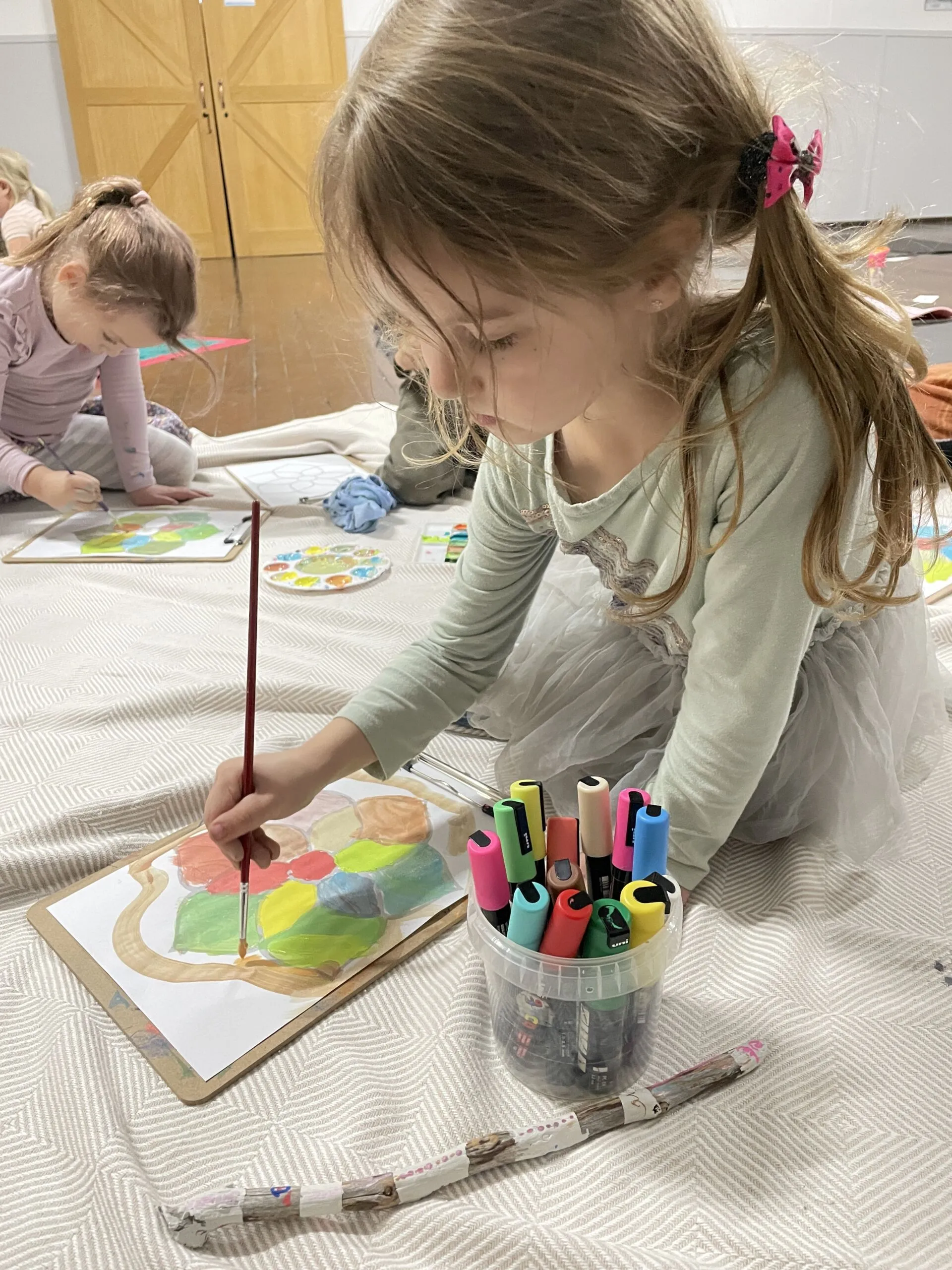 Childrens Mandala Painting Young girl Painting a Mandala to Colour it in.
